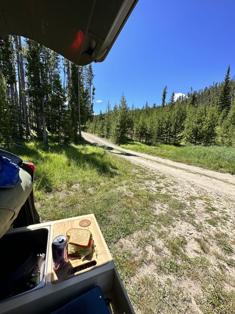 sandwich at campsite while solo camping